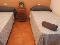 A bed or beds in a room at CAL GARRETA