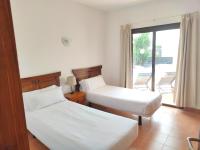 Postel nebo postele na pokoji v ubytování Villas Blancas