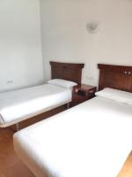 Postel nebo postele na pokoji v ubytování Villas Blancas