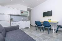 Kuchyň nebo kuchyňský kout v ubytování Apartments SIME