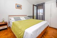 Postel nebo postele na pokoji v ubytování Apartments SIME