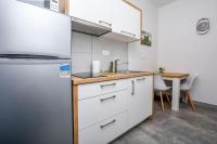 Kuchyň nebo kuchyňský kout v ubytování Apartments SIME