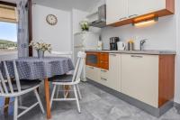 Kuchyň nebo kuchyňský kout v ubytování Apartments SIME