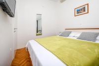 Postel nebo postele na pokoji v ubytování Apartments SIME