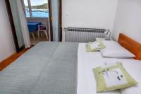 Postel nebo postele na pokoji v ubytování Apartments SIME