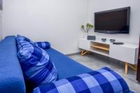 TV a/nebo společenská místnost v ubytování Apartments SIME