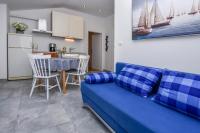 Kuchyň nebo kuchyňský kout v ubytování Apartments SIME