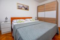 Postel nebo postele na pokoji v ubytování Apartments SIME