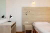 Łóżko lub łóżka w pokoju w obiekcie Apto con Terraza 102