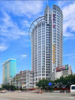 a tall building with a roller coaster on top of it at Paco Hotel Yan Jiang Road Tuan Yi Da Metro Guangzhou-Free shuttle bus to Canton Fair in Guangzhou