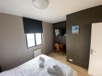 Łóżko lub łóżka w pokoju w obiekcie Parc Beausejour Aparthotel