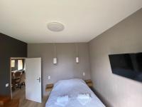 Telewizja i/lub zestaw kina domowego w obiekcie Parc Beausejour Aparthotel