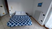 A bed or beds in a room at Appartamento Alessandro