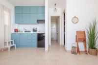 A kitchen or kitchenette at Kallopsia - Glifada Beach Menigos Resort by New Era