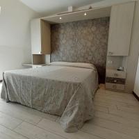 Łóżko lub łóżka w pokoju w obiekcie Hotel Arlecchino