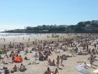 a large crowd of people on a beach at Hôtel Emilie in Royan