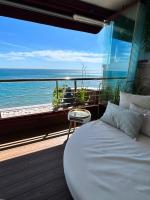 A bed or beds in a room at PARADISE SUITES Buenavista Beach