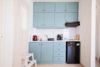 A kitchen or kitchenette at Kallopsia - Glifada Beach Menigos Resort by New Era