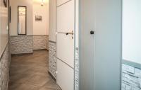 a hallway with a door and a tile floor at Awesome Home In Paimpol With Kitchen in Paimpol