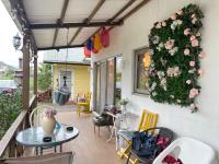 a patio with a table and a wreath of flowers at Star Wish B&amp;B in Dongshan
