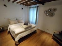 Łóżko lub łóżka w pokoju w obiekcie Appartement proche DisneyLand et Paris