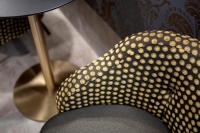 a chair with gold polka dots on it at Alle Guglie Boutique Hotel in Venice