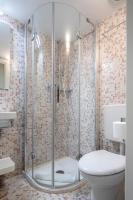 a bathroom with a shower and a toilet at Alle Guglie Boutique Hotel in Venice