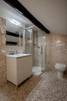 a bathroom with a shower and a sink and a toilet at Alle Guglie Boutique Hotel in Venice