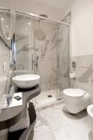 a bathroom with a shower and a sink and a toilet at Alle Guglie Boutique Hotel in Venice