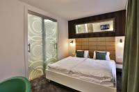 Posteľ alebo postele v izbe v ubytovaní VIP Apartments