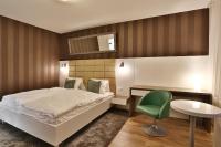 Posteľ alebo postele v izbe v ubytovaní VIP Apartments
