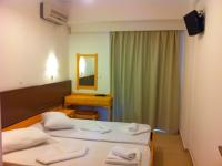 Postel nebo postele na pokoji v ubytování Fantasia Hotel Apartments