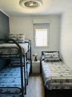 Postel nebo postele na pokoji v ubytování DELUX apartament Salou