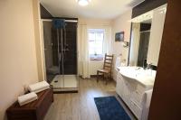 a bathroom with a shower and a sink at Pension Alte Scheune in Melsungen