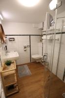 a bathroom with a shower and a sink and a toilet at Pension Alte Scheune in Melsungen