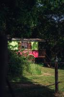 a small red and green house in a field at Dihan Evasion in Ploemel