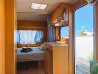 A bed or beds in a room at Glamping Caravan Lanzarote