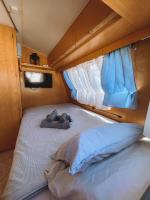 A bed or beds in a room at Glamping Caravan Lanzarote