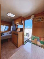 A bed or beds in a room at Glamping Caravan Lanzarote