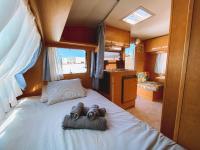 A bed or beds in a room at Glamping Caravan Lanzarote
