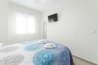 A bed or beds in a room at Egeu