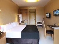 a hotel room with a large bed and a bathroom at Axel Hotel Barcelona - Adults Only in Barcelona