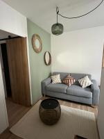 a living room with a couch and a table at Appartement Hendaye in Urrugne