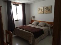 Cama o camas de una habitación en Hostal Alcázar