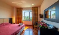 A bed or beds in a room at Victoria Terme Hotel
