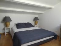 Łóżko lub łóżka w pokoju w obiekcie La bastide de LORGUES 83