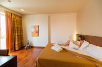A bed or beds in a room at Victoria Terme Hotel