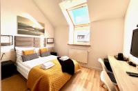 Łóżko lub łóżka w pokoju w obiekcie Hotel77
