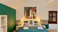 Łóżko lub łóżka w pokoju w obiekcie Hotel77