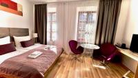 Łóżko lub łóżka w pokoju w obiekcie Hotel77